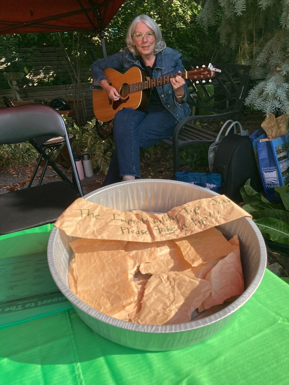 Sheelagh and the “tip” jar at Passport to the Arts